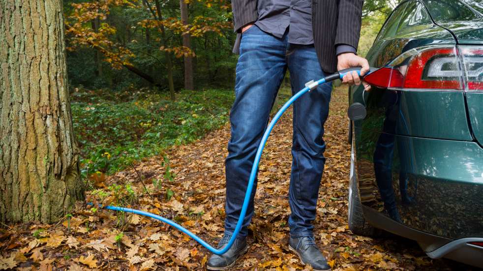 charging a hybrid car in the woods